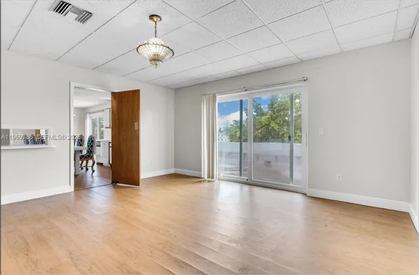 a view of an empty room with a window