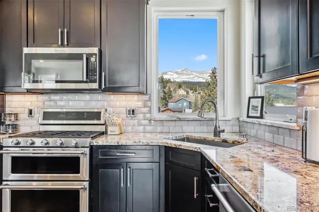 a kitchen with a stove and a sink