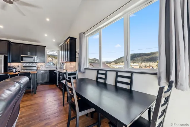 a white toilet sitting next to a shower