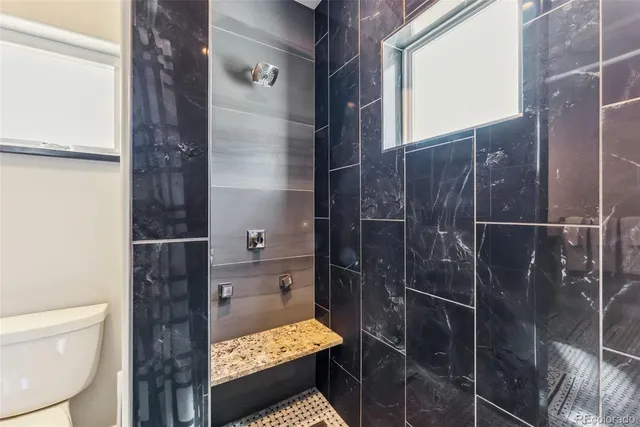 a bed room with a bed and a large mirror