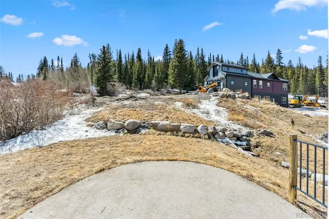 a view of multiple houses with a road
