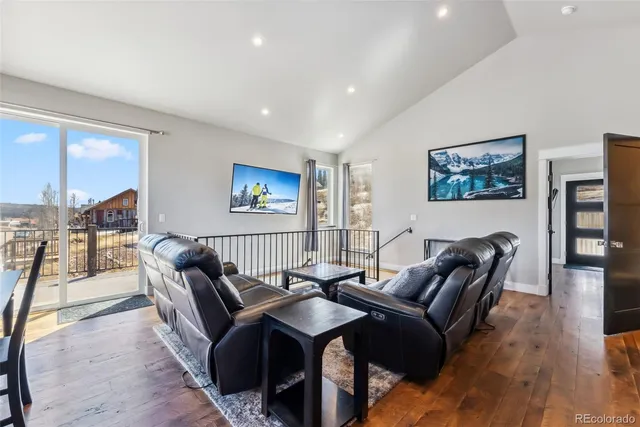 a view of a livingroom with furniture and wooden floor