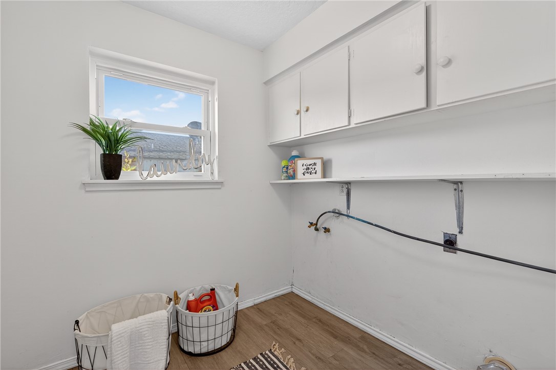 103 Granby Place Portland, TX 78374 - Photo 18 of 40 a room with cabinets and a wooden floor