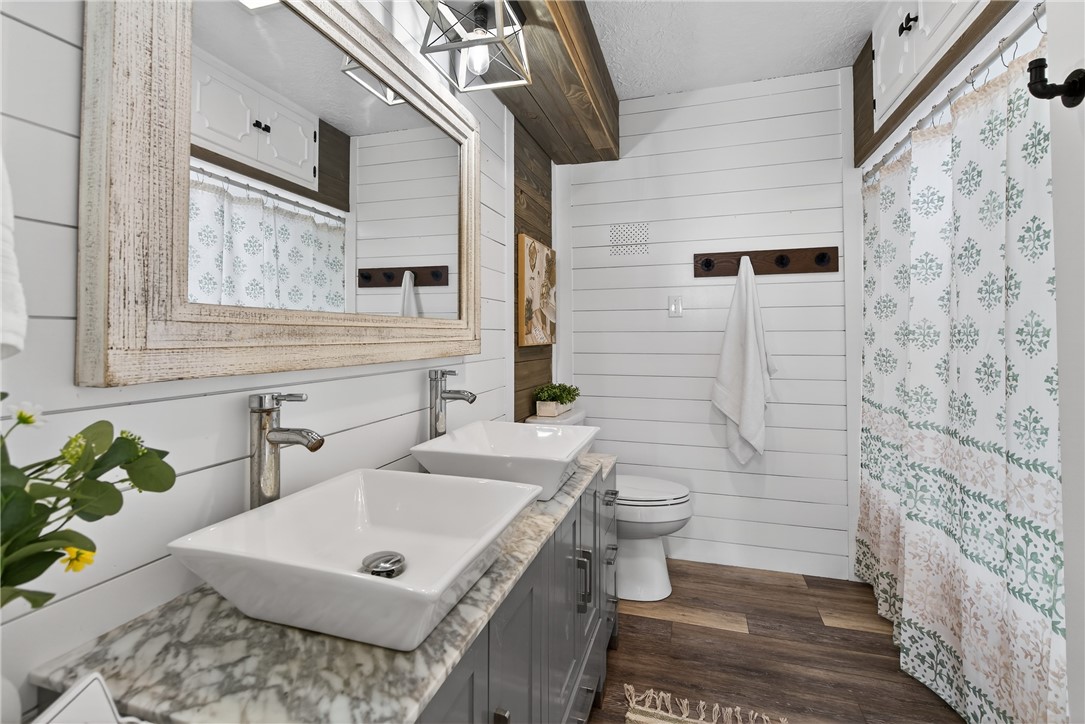 103 Granby Place Portland, TX 78374 - Photo 27 of 40 a bathroom with a sink a toilet and mirror