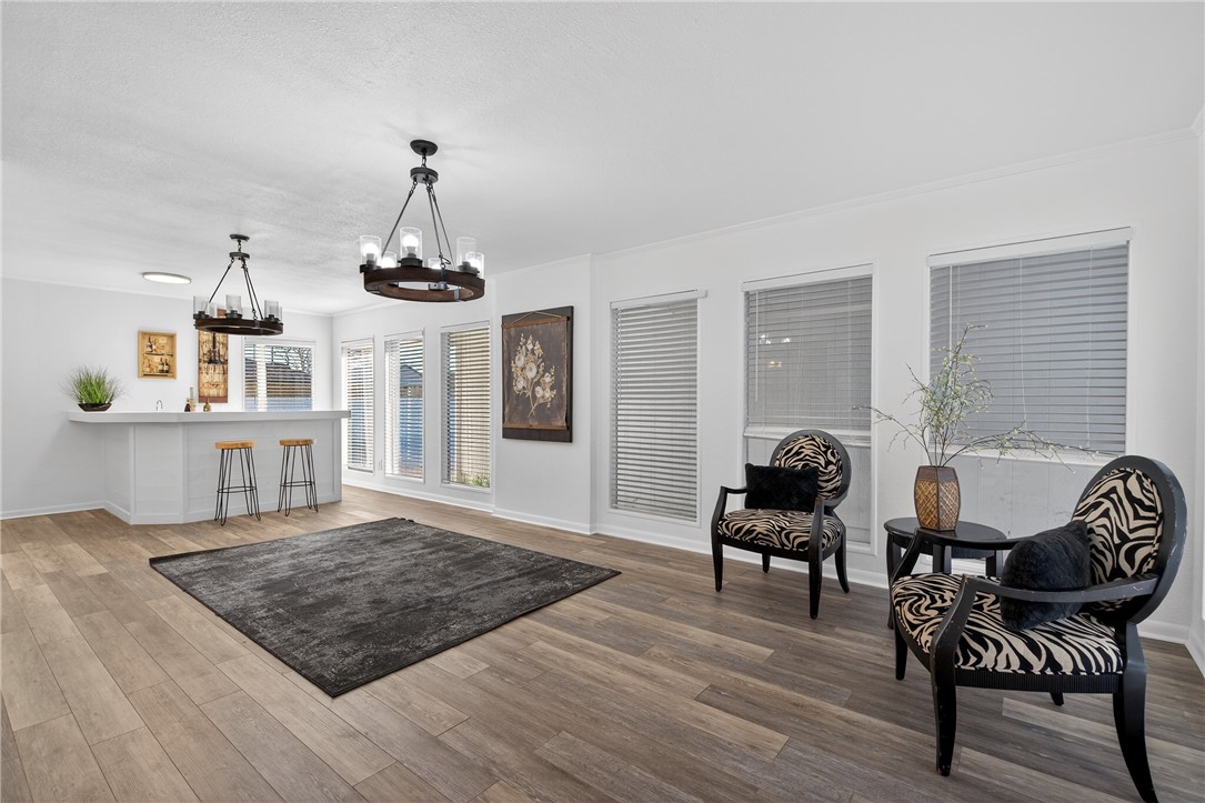 103 Granby Place Portland, TX 78374 - Photo 10 of 40 a living room with furniture and a chandelier