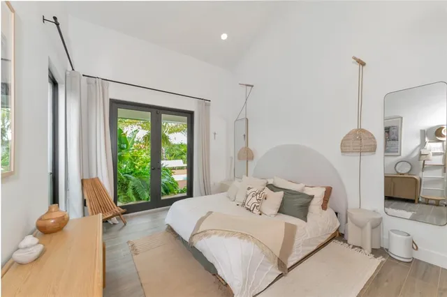 a bed room with a bed and a window