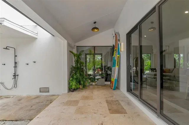 a very nice looking room with a glass door and shower
