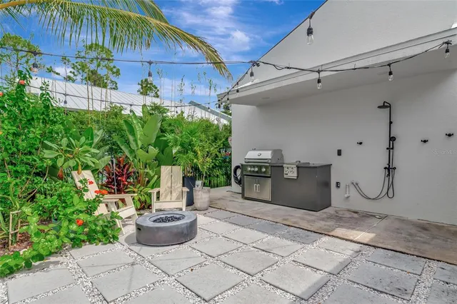 a room with lots of potted plants