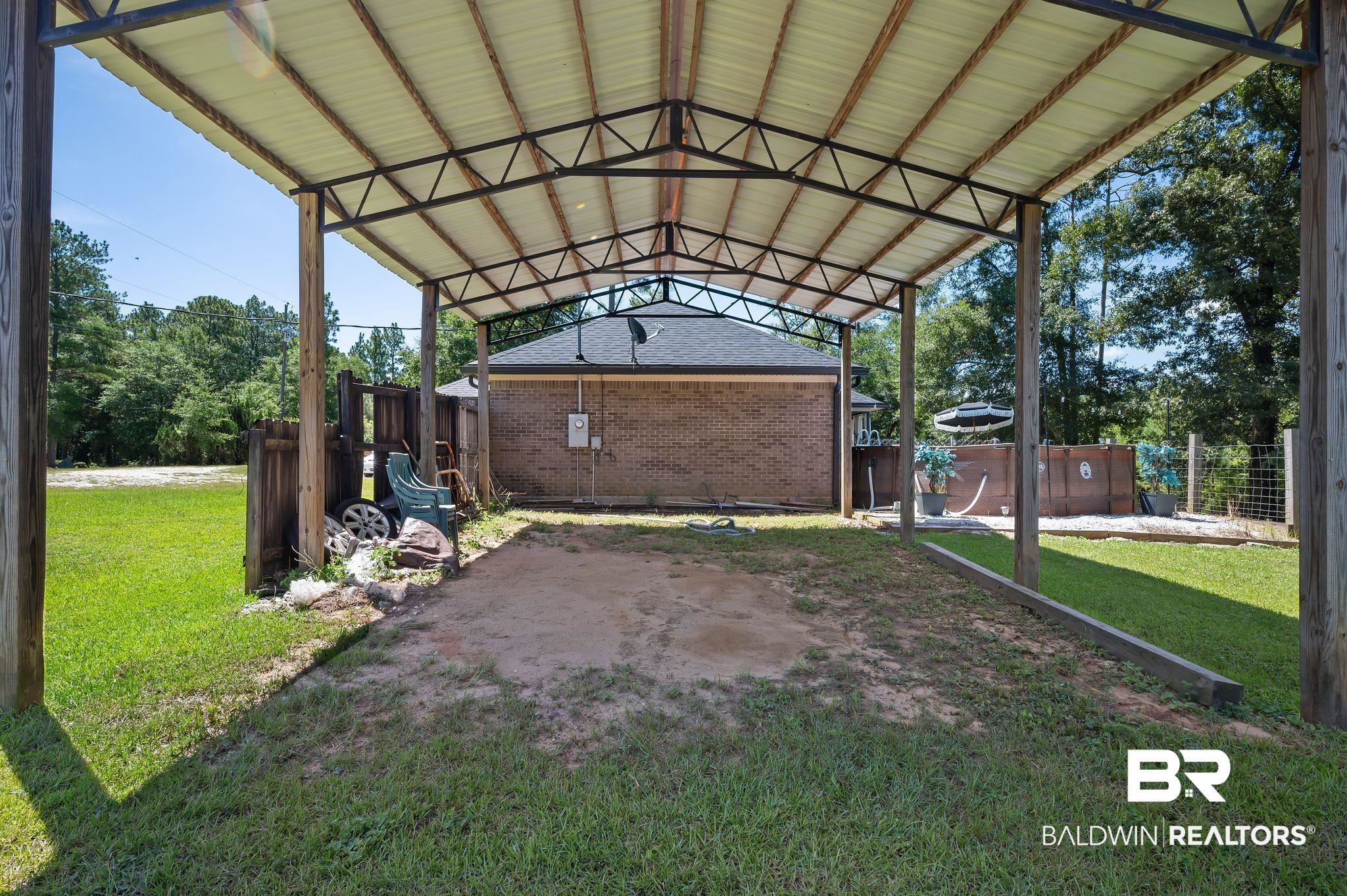52923 Ammons Road Perdido, AL 36562 - Photo 29 of 35 View of parking featuring a carport