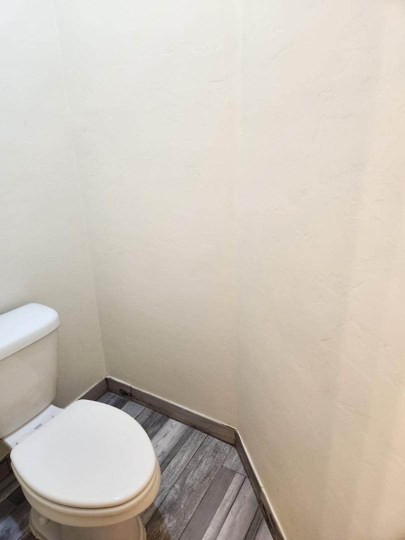 3641 Camino Del Rancho Douglas, AZ 85607 - Photo 13 of 20 a white toilet sitting next to a white wall