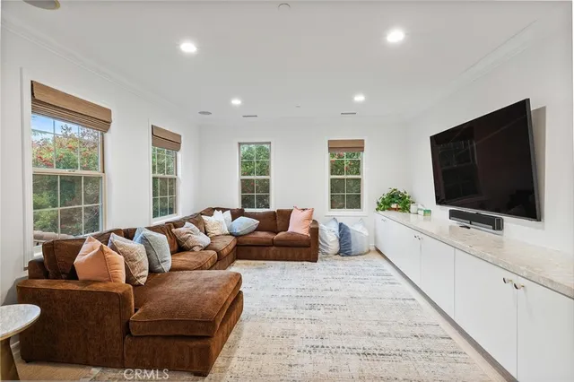 a living room with a couch and a window