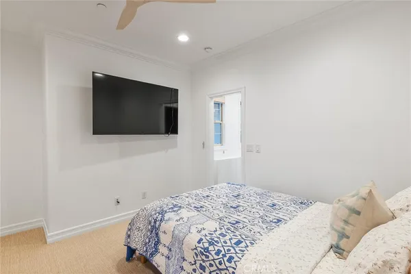 a bedroom with a bed and a couch