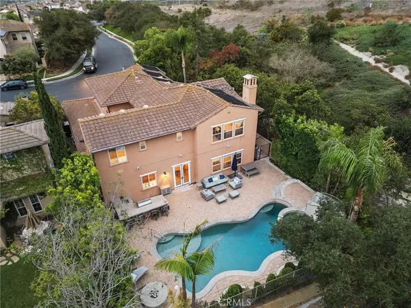 an aerial view of a house with outdoor space