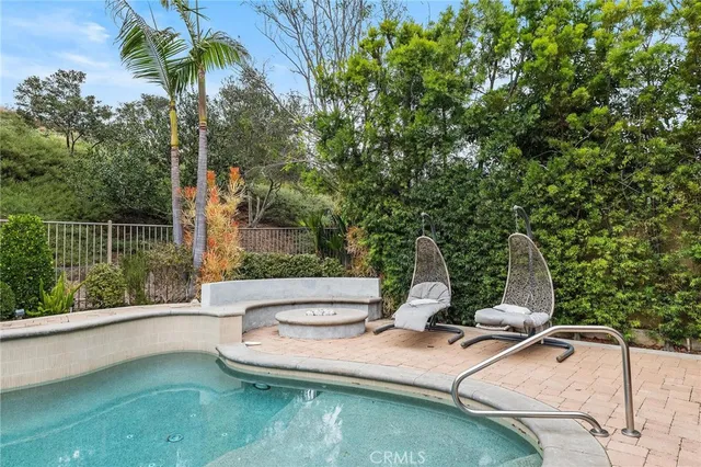 a backyard of a house with outdoor seating