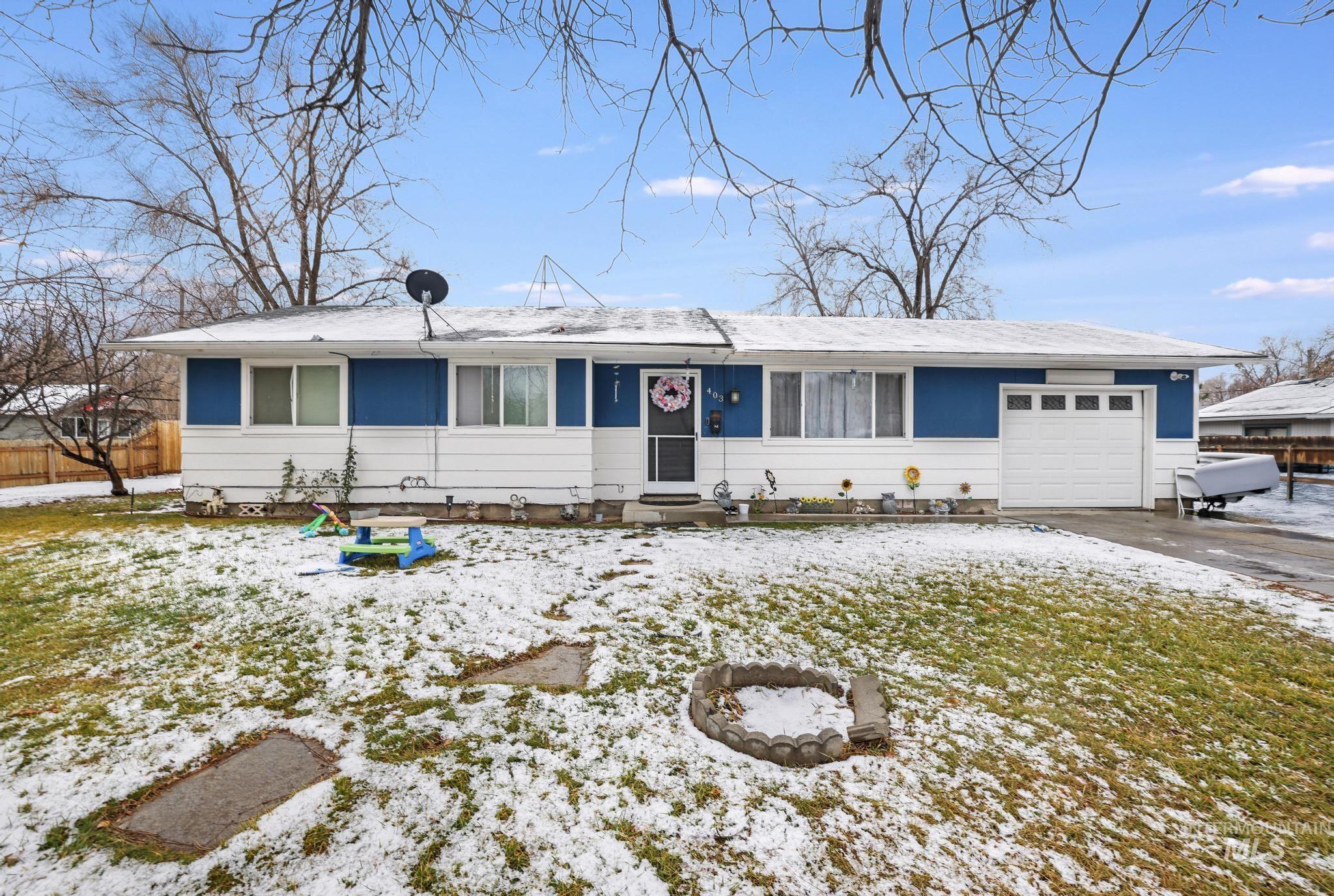 403 3rd Avenue West Jerome, ID 83338 - Photo 3 of 36 Single story home with an attached garage and driveway