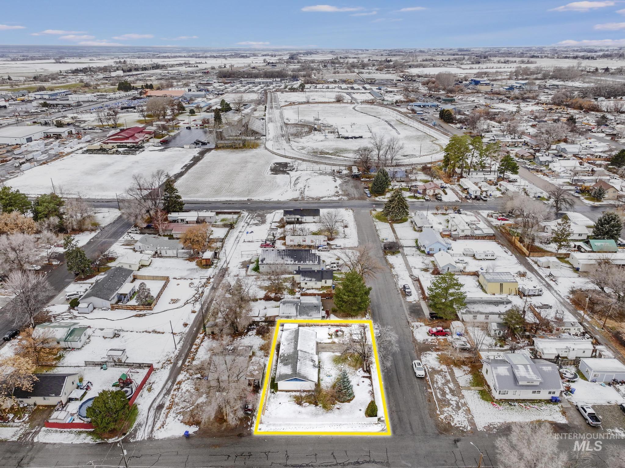 403 3rd Avenue West Jerome, ID 83338 - Photo 34 of 36 Snowy aerial view with property boundaries highlighted and a residential view