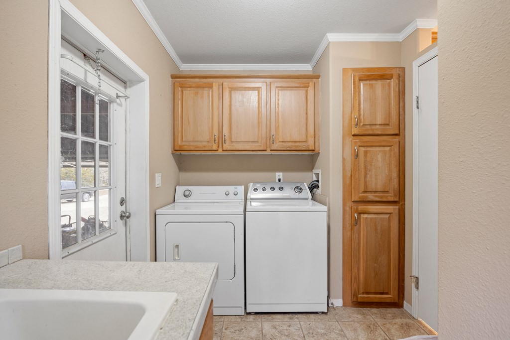 3955 Klein Branch Road Harper, TX 78631 - Photo 13 of 40 a utility room with dryer and washer