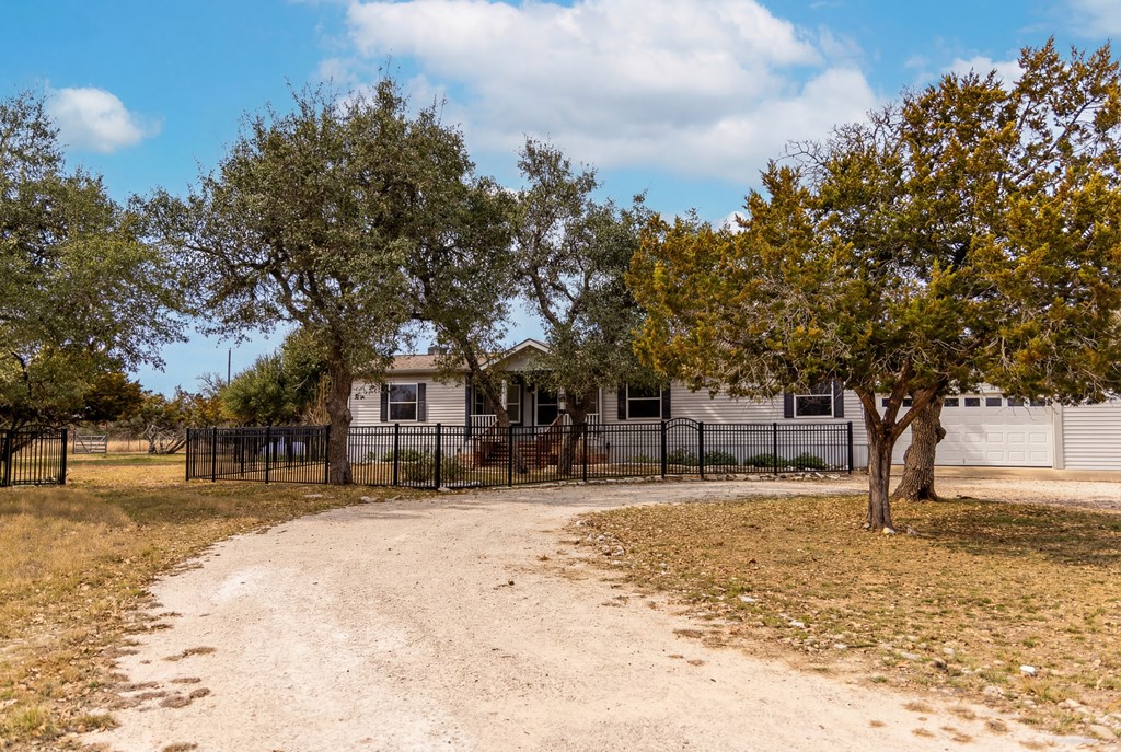 3955 Klein Branch Road Harper, TX 78631 - Photo 3 of 40 a house with trees in the background