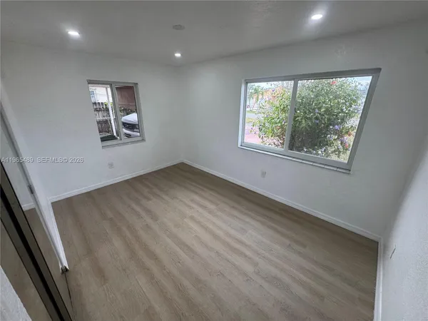 an empty room with windows