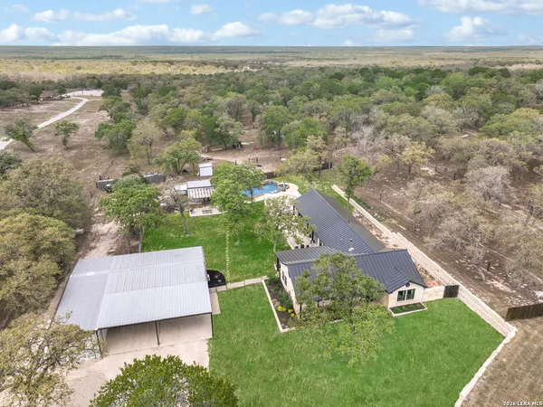 an aerial view of residential house with outdoor space