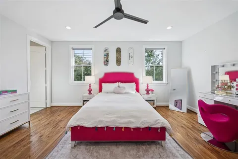 a kitchen with stainless steel appliances cabinets and a living room
