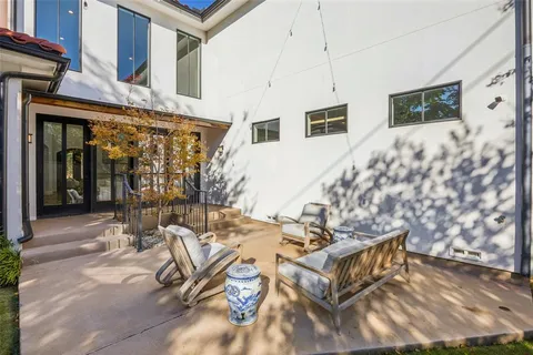 a bathroom with a double vanity sink toilet and shower