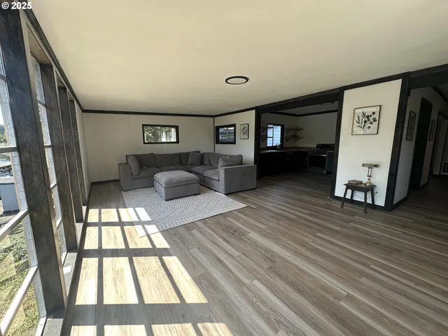 a view of livingroom with furniture and window