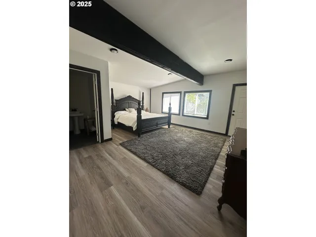 a living room with a couch and next to a window