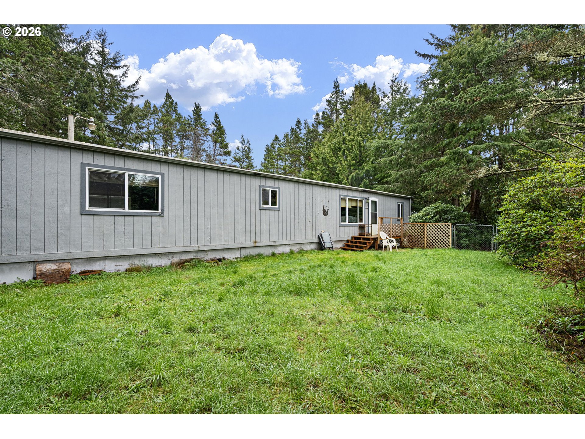 4826 Rhododendron Loop Florence, OR 97439 - Photo 29 of 41 a front view of a house with garden