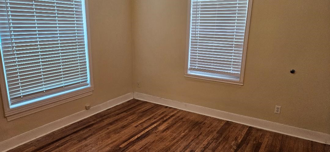 932 Walling Street Houston, TX 77009 - Photo 11 of 14 a view of a room with wooden floor and a window