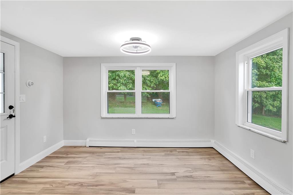 2 Hillcrest Drive Cecil, PA 15321 - Photo 13 of 25 a view of an empty room with wooden floor and a window