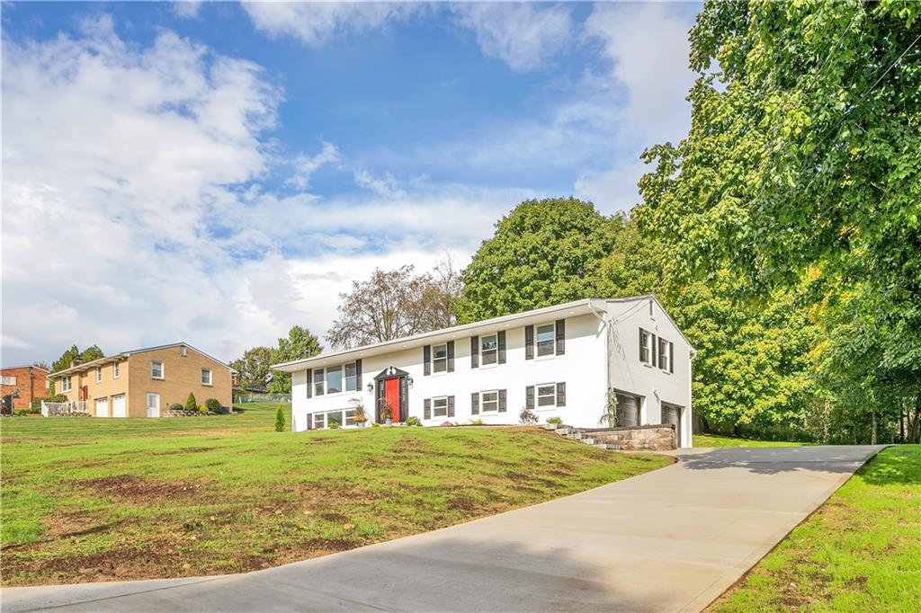 2 Hillcrest Drive Cecil, PA 15321 - Photo 2 of 25 a view of a white house next to a yard with big trees