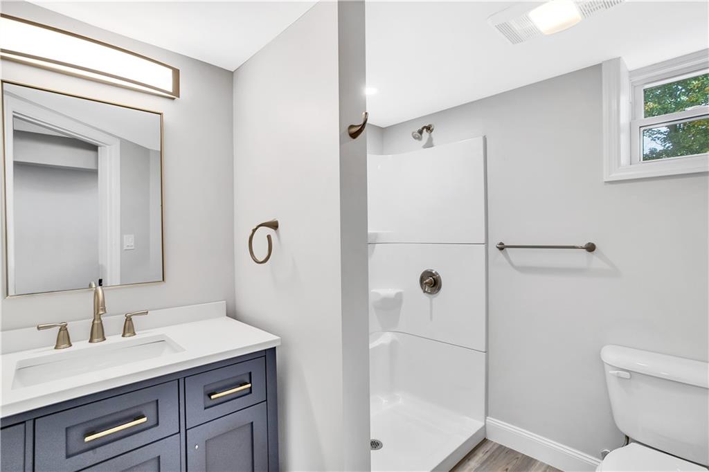 2 Hillcrest Drive Cecil, PA 15321 - Photo 23 of 25 a bathroom with a granite countertop sink toilet and shower