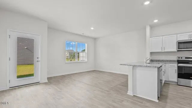a view of kitchen with wooden floor