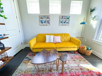 a bedroom with a bed and a couch