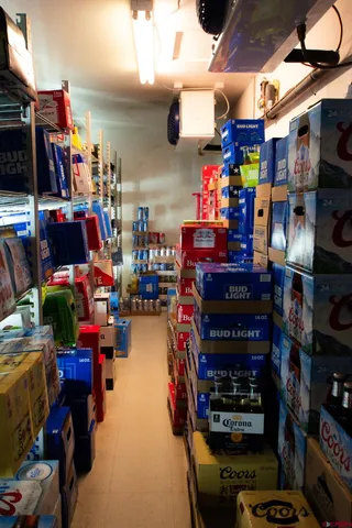 a kitchen with stainless steel appliances kitchen island granite countertop a sink and cabinets