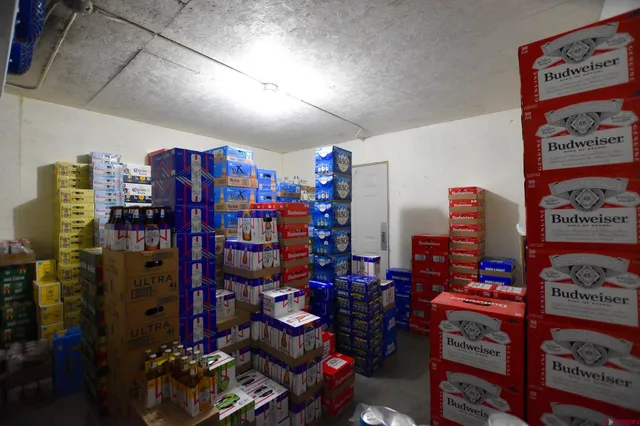 a kitchen with stainless steel appliances kitchen island granite countertop a refrigerator and a stove