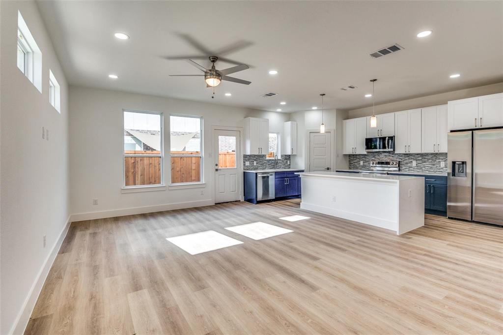 7307 Rubio Place Dallas, TX 75235 - Photo 5 of 17 a view of kitchen with sink and wooden floor