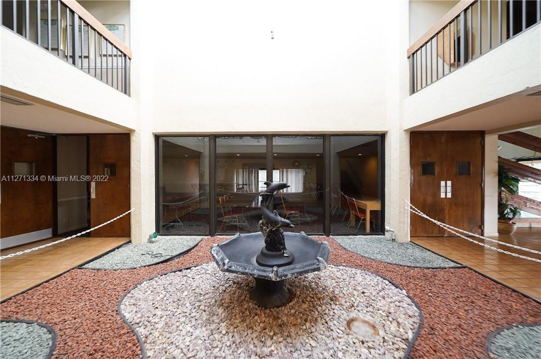 8050 West McNab Road, Unit 216 Tamarac, FL 33321 - Photo 5 of 16 a lobby with furniture