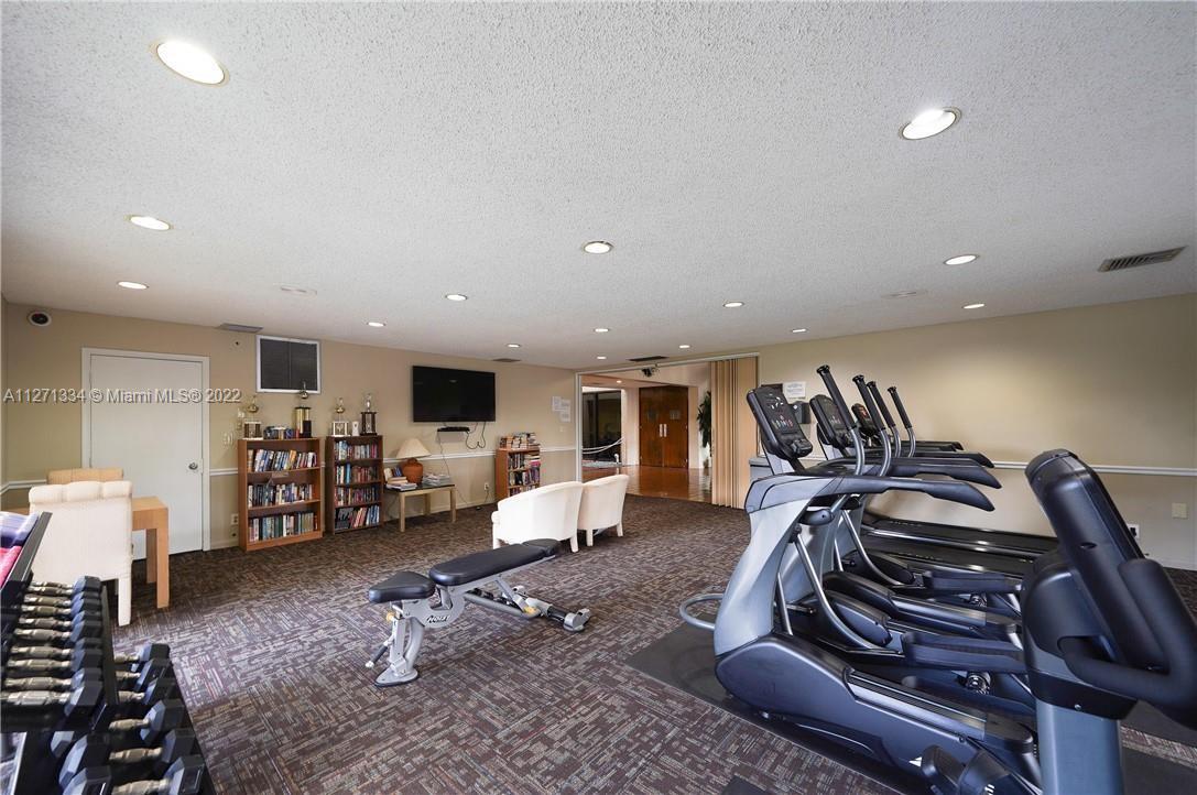 8050 West McNab Road, Unit 216 Tamarac, FL 33321 - Photo 6 of 16 a view of a room with gym equipment