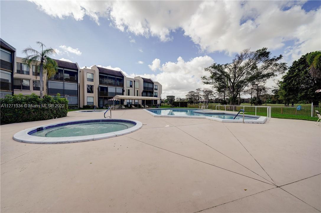 8050 West McNab Road, Unit 216 Tamarac, FL 33321 - Photo 7 of 16 a view of a community park