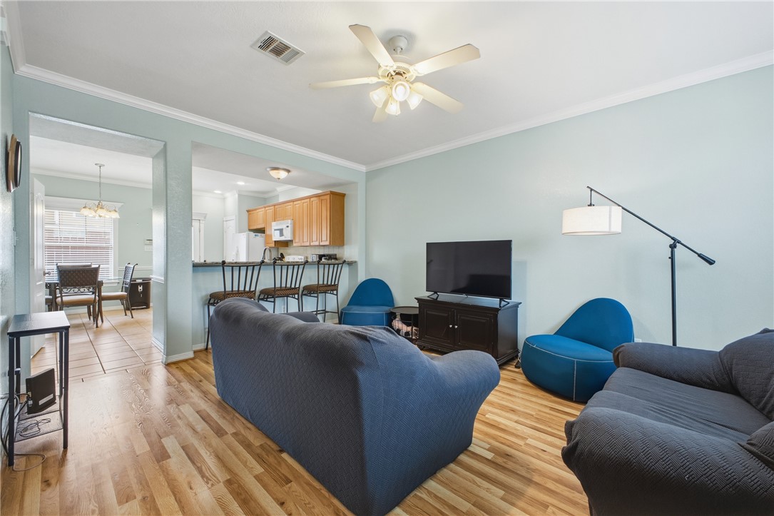 1000 Spring Loop, Unit 2105 College Station, TX 77840 - Photo 7 of 22 a living room with furniture and a flat screen tv