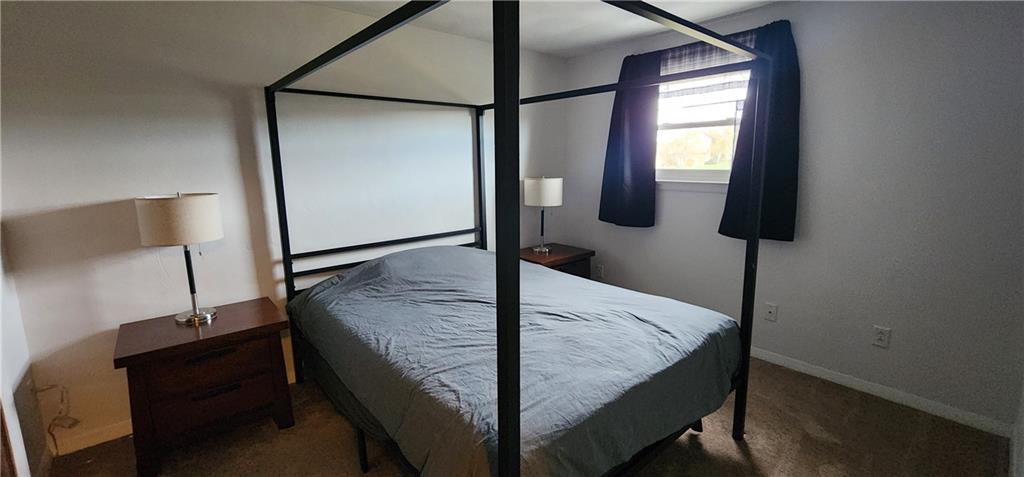 4833 Lucerne Road Indiana, PA 15701 - Photo 13 of 16 a bed room with a bed and a mirror