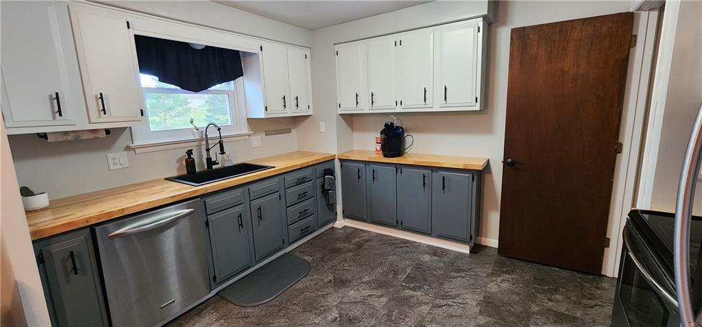 4833 Lucerne Road Indiana, PA 15701 - Photo 4 of 16 a kitchen with stainless steel appliances granite countertop a sink a stove and a refrigerator