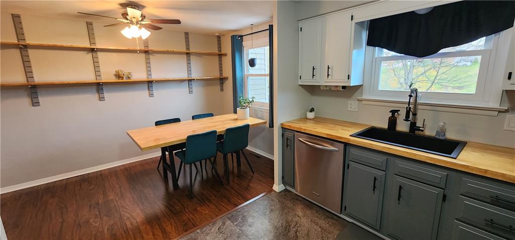 4833 Lucerne Road Indiana, PA 15701 - Photo 6 of 16 a kitchen with stainless steel appliances a table chairs in it and a window