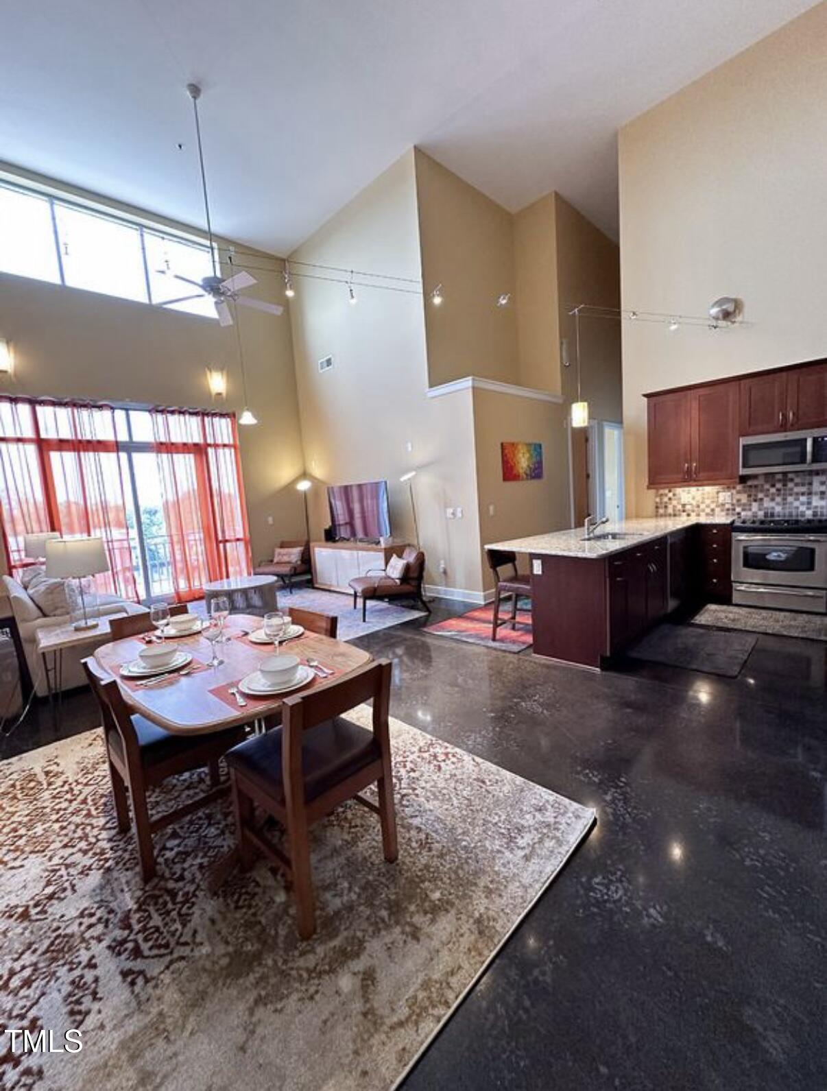 a room with dining table and chairs