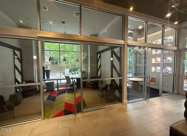 a room with lots of furniture and a large window