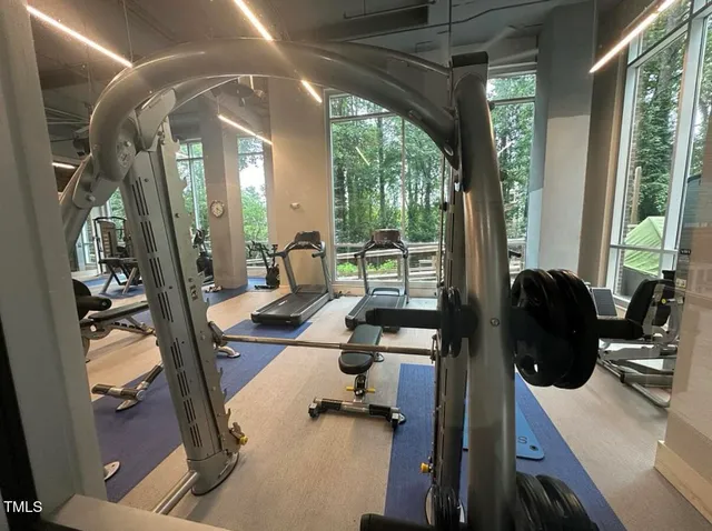 a view of a livingroom with furniture and large windows