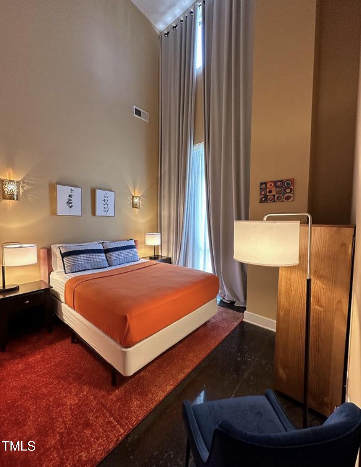 2608 Erwin Road, Unit 403 Durham, NC 27705 - Photo 8 of 15 a bed room with a bed and a night stand