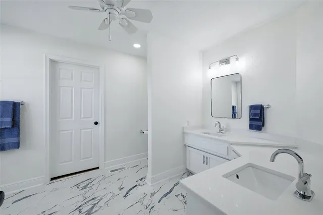 a bathroom with a sink and mirror